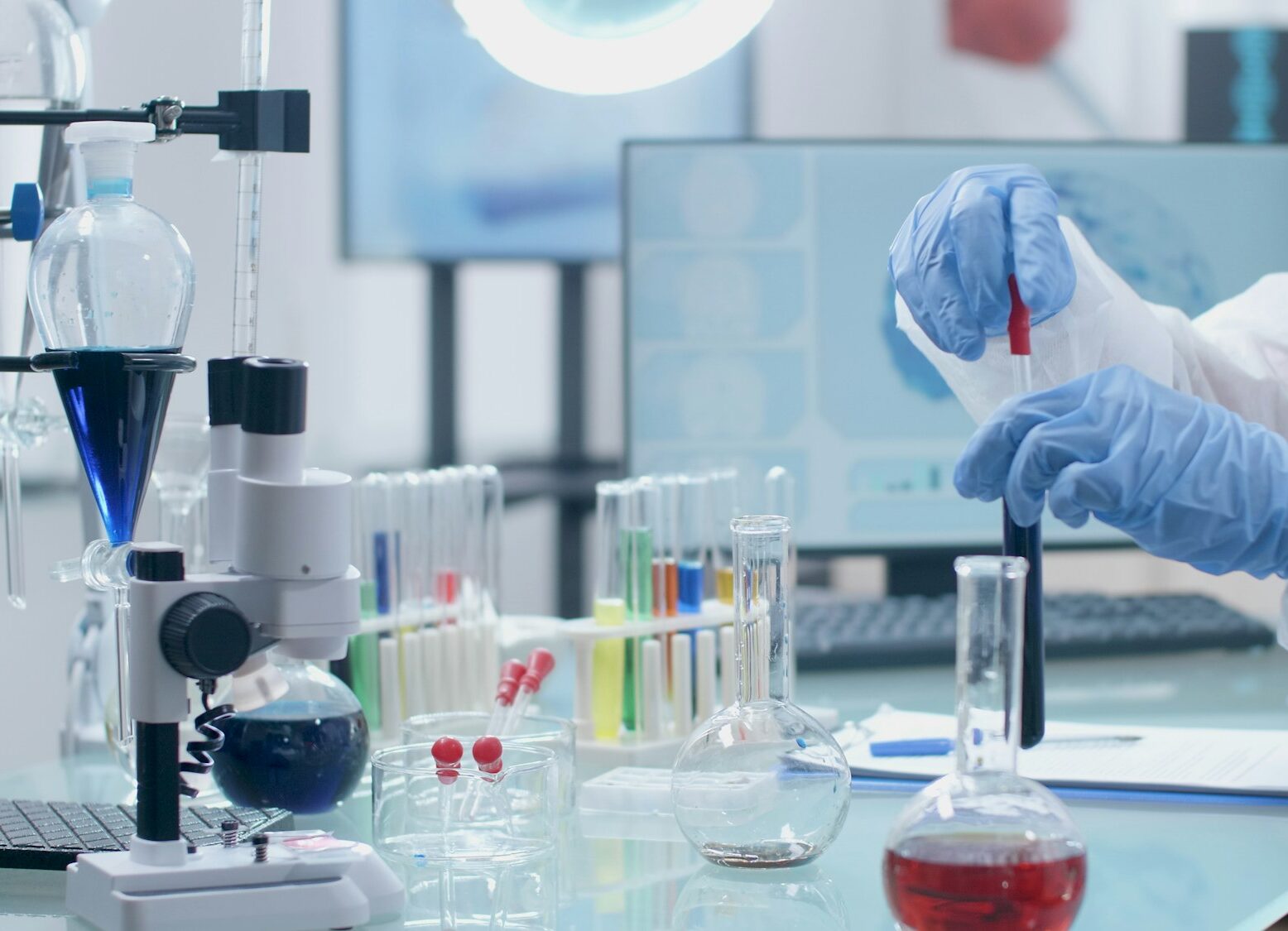 Scientist researcher working with medical test tube analyzing green liquid